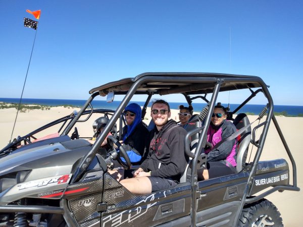 a man riding on the back of a truck