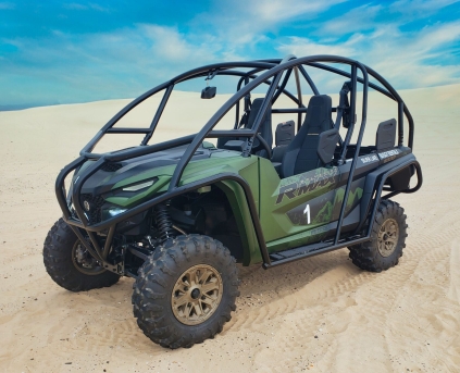 a car driving down a dirt road