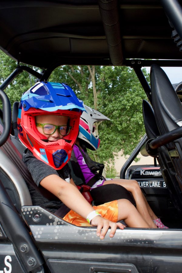 a person riding on the back of a car