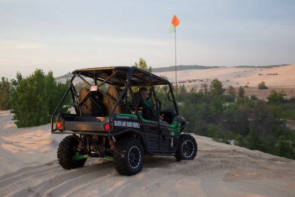 Teryx about to go down a dune