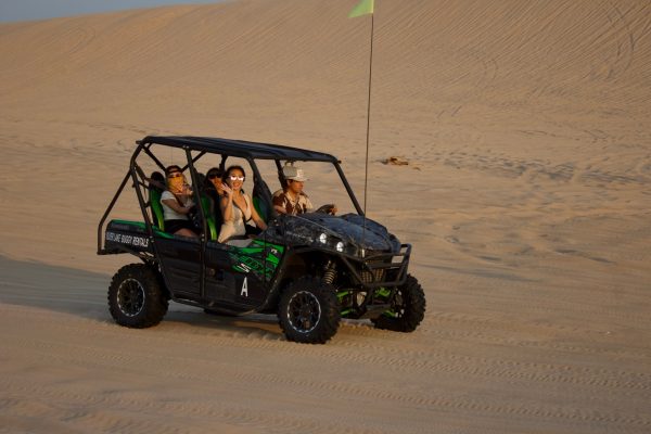 a truck driving down a dirt road