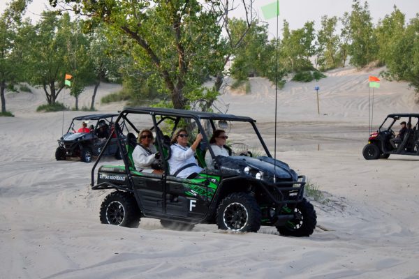 a car parked in front of a truck